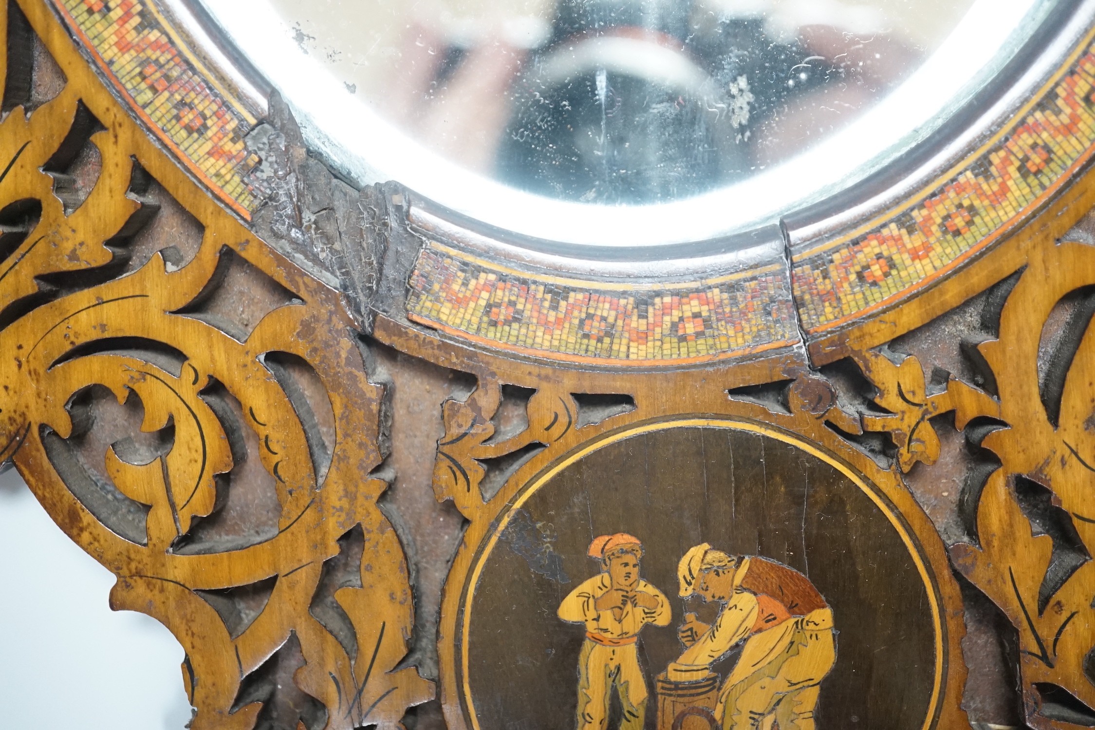 A 19th century fretted olivewood Sorrento ware toilet mirror, 45cm long